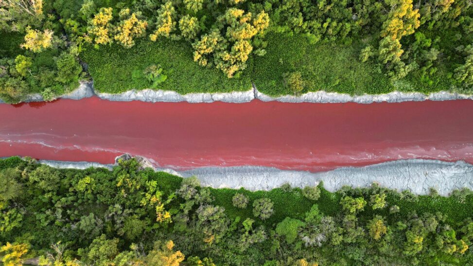River In Argentina Turns Bright Red