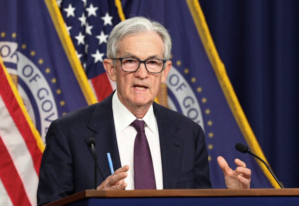 Divided fed holds key interest rate steady, defying trump's demands for aggressive cuts