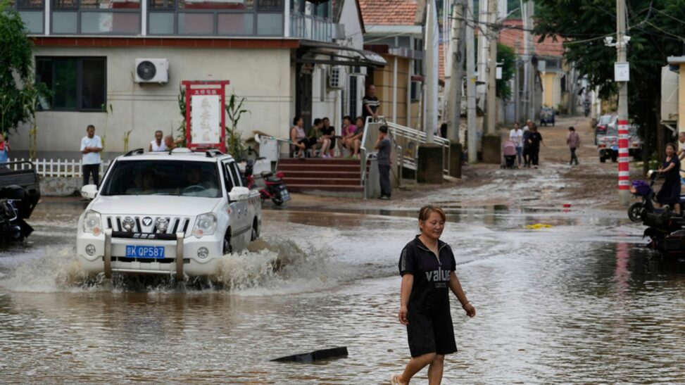 China floods: at least 30 killed in beijing and 80,000 evacuated