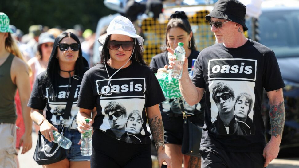 'it's a cultural moment': oasis fans queue all day for manchester homecoming gig