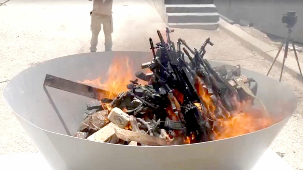 Kurdish fighters burn weapons in significant step towards peace with turkey