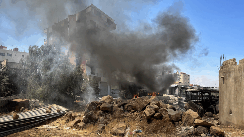 Inside besieged syrian city ravaged by sectarian violence where bodies line streets and homes are burned