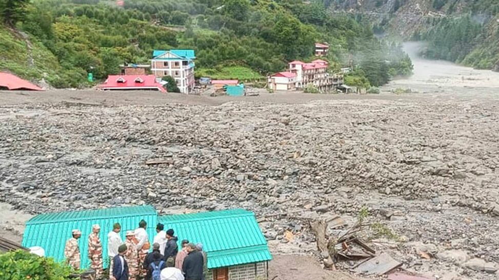 Dozens believed to be trapped under rubble after flash floods in northern india