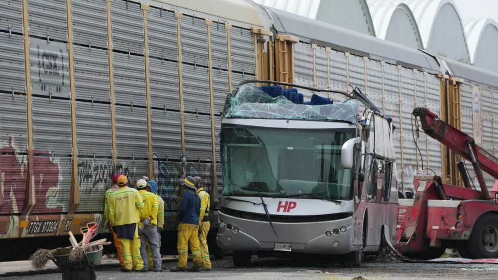 At least 10 dead, 41 injured, after train rams bus