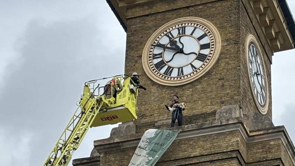 Protester arrested after climbing london clock tower while clutching a dog