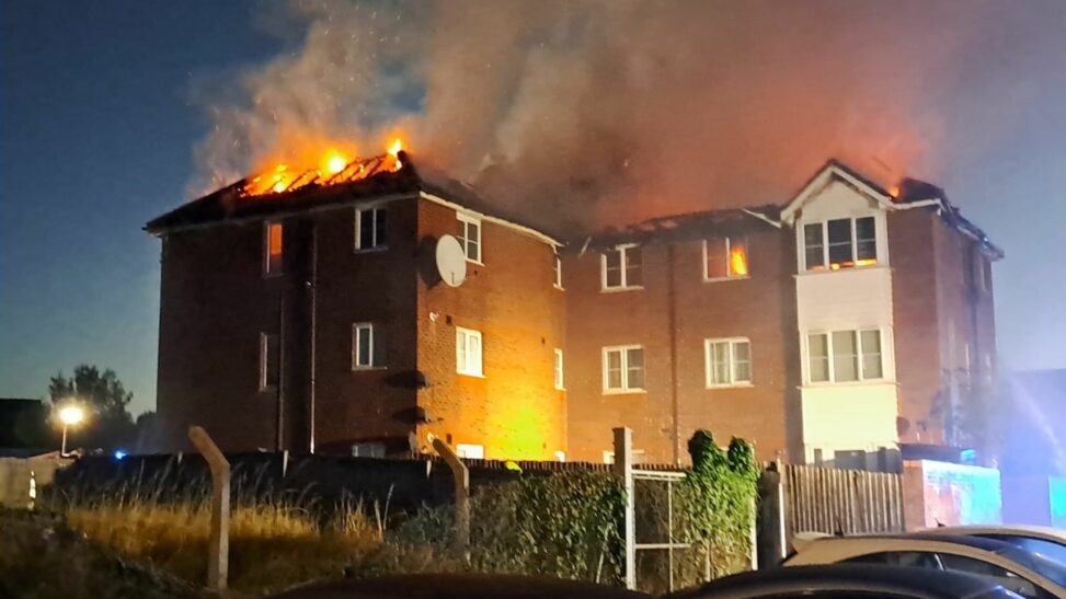 Three children taken to hospital after fire tears through three storey block of flats