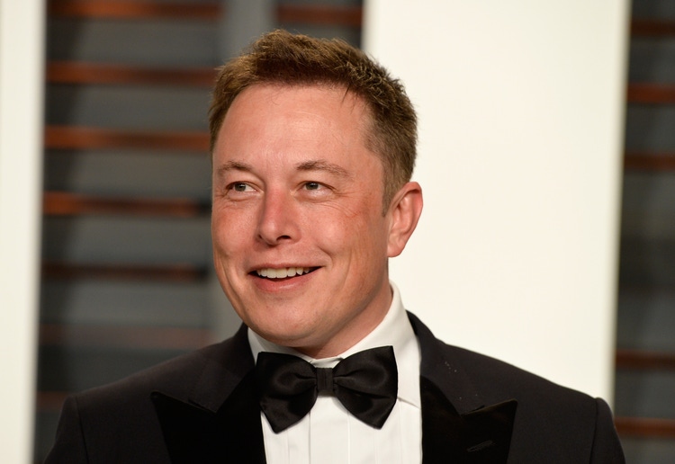 Elon musk says tesla fsd 14 launch postponed to monday