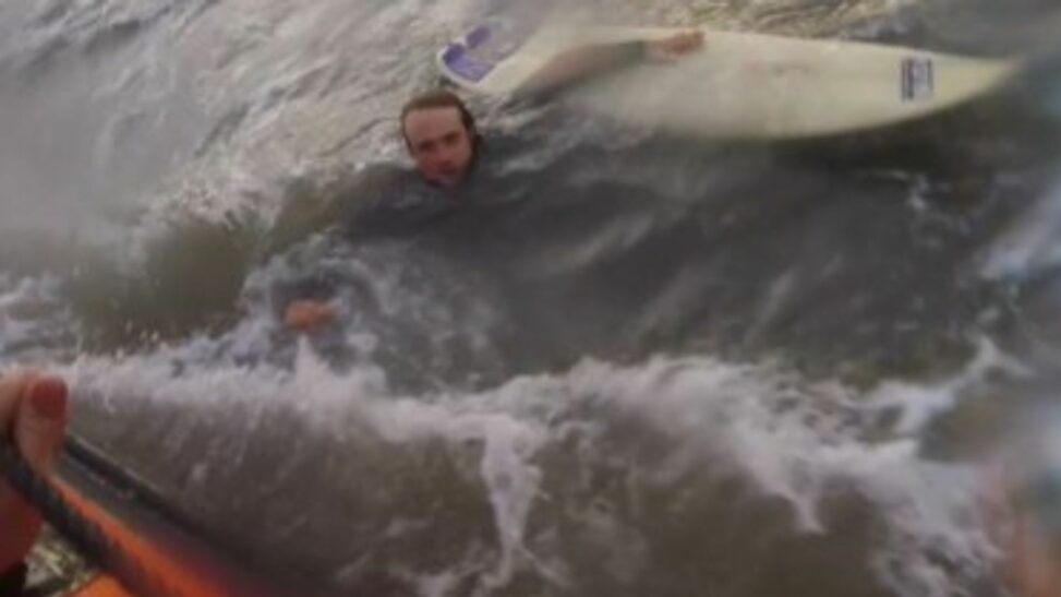 Video shows surfer being rescued after powerful rip current dragged him out to sea