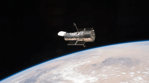 A figure eight in deep space: hubble image shows gravity warping distant galaxies